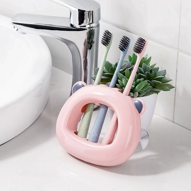 Soporte rosa para cepillos de dientes