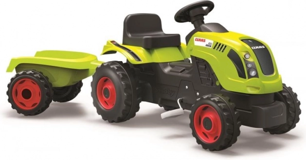 Tractor de pedales CLAAS con remolque verde
