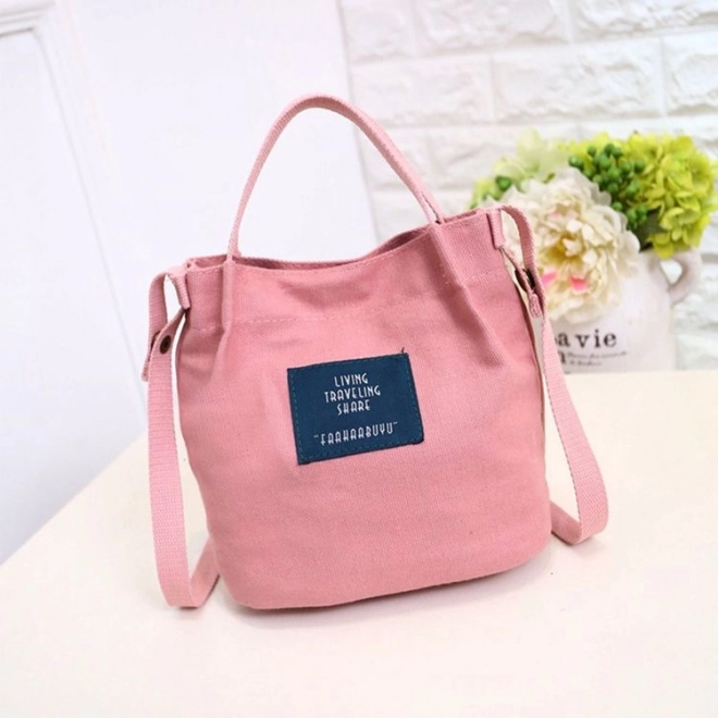 Bolso messenger de tela rosa