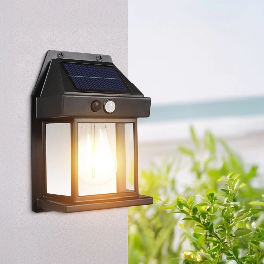 Lámpara solar de pared con sensor de movimiento y bombilla LED de filamento, negra