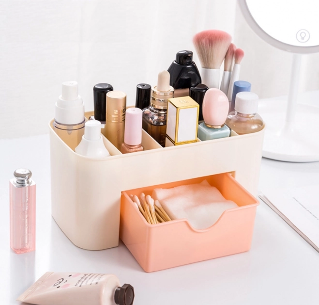 Organizador elegante de cosméticos con cajón en color blanco y rosa