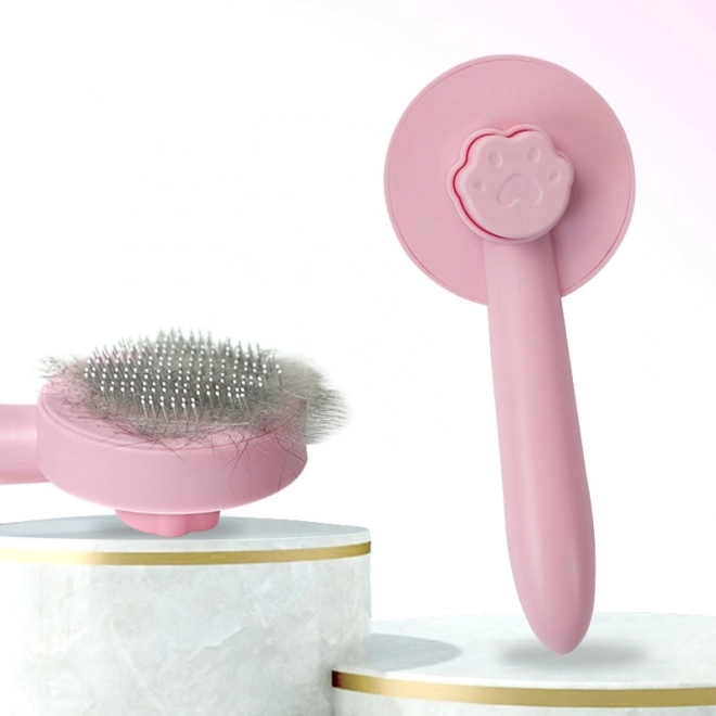 Cepillo rosa para desenredar el pelo para perros y gatos