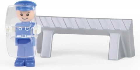 Figura de policía y barrera de tráfico